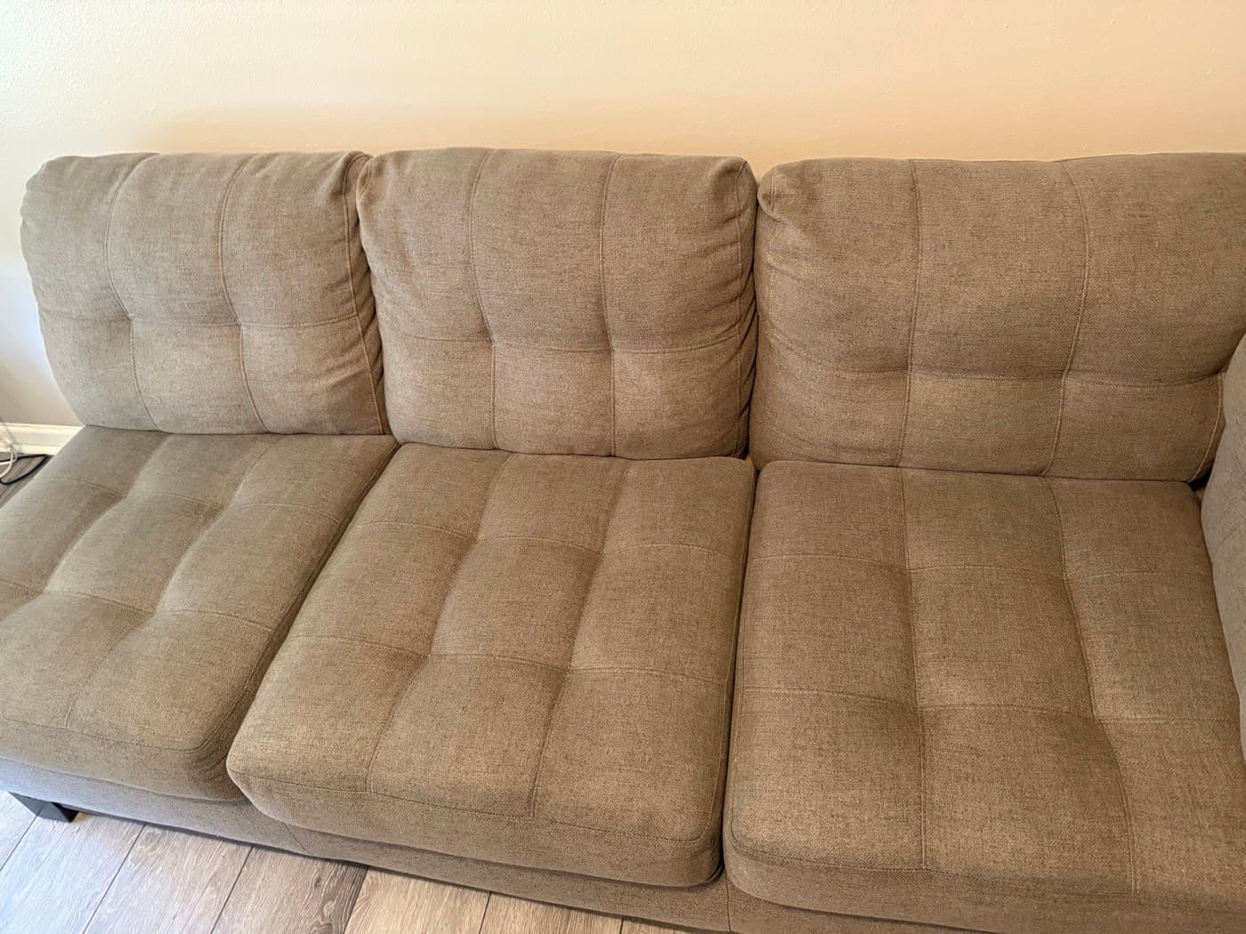 A taupe three-seat sofa after steam cleaning