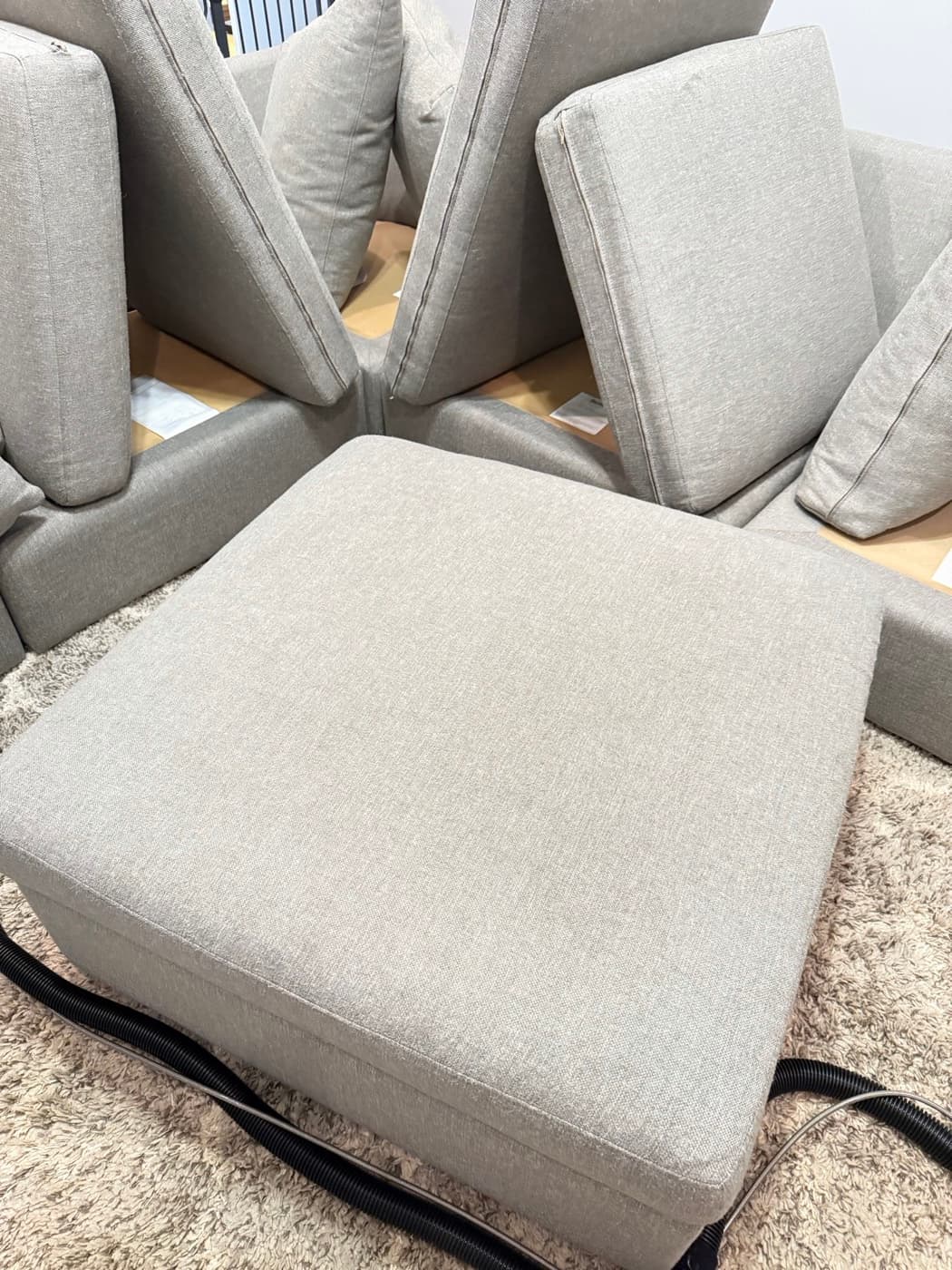 The same cream sofa back and seat cushions after steam cleaning