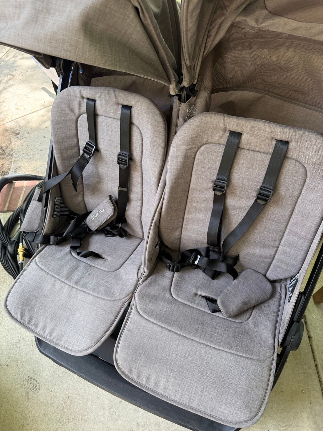 The same double stroller seats after steam cleaning