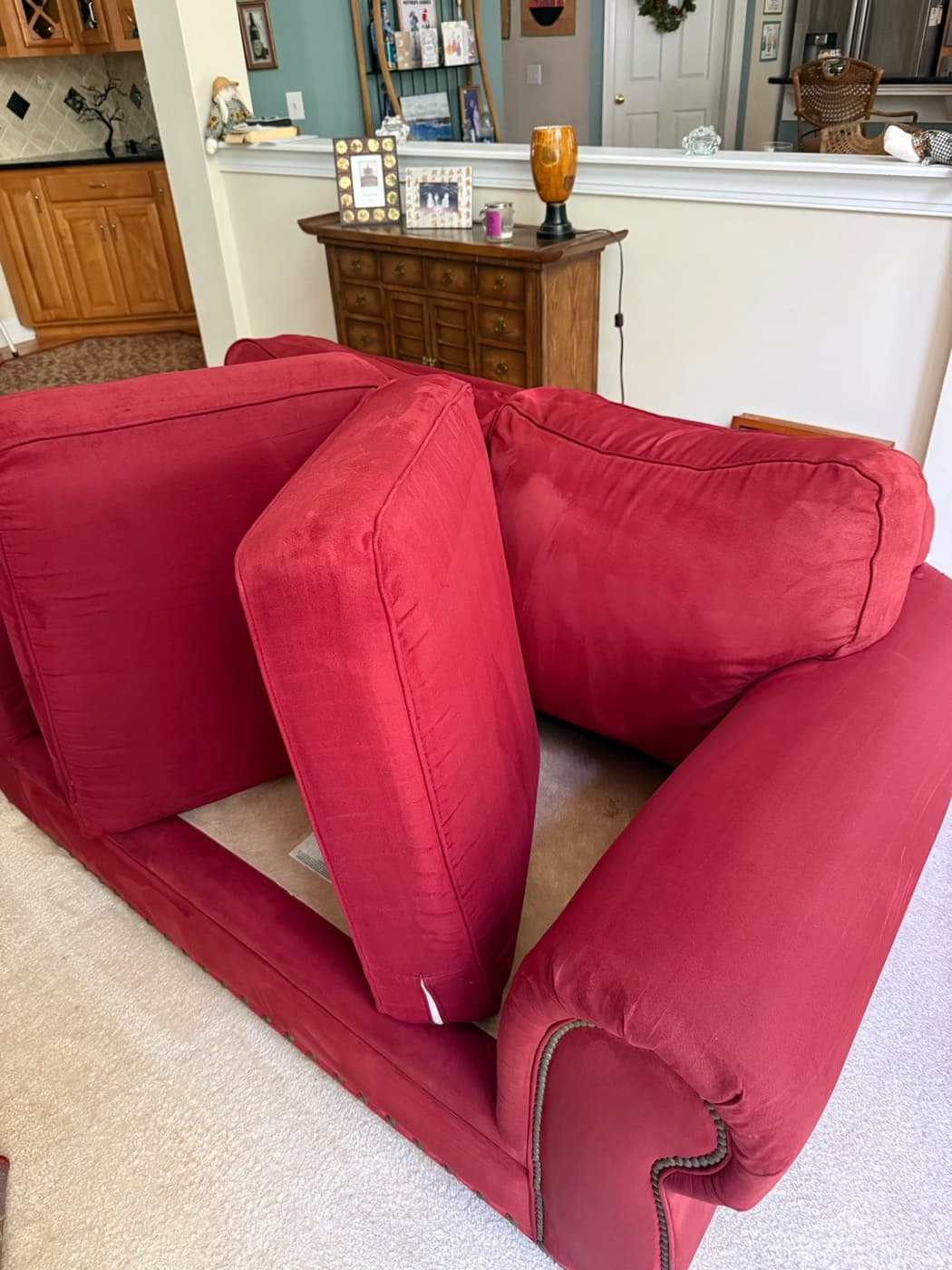 The same red fabric recliner armchair after steam cleaning