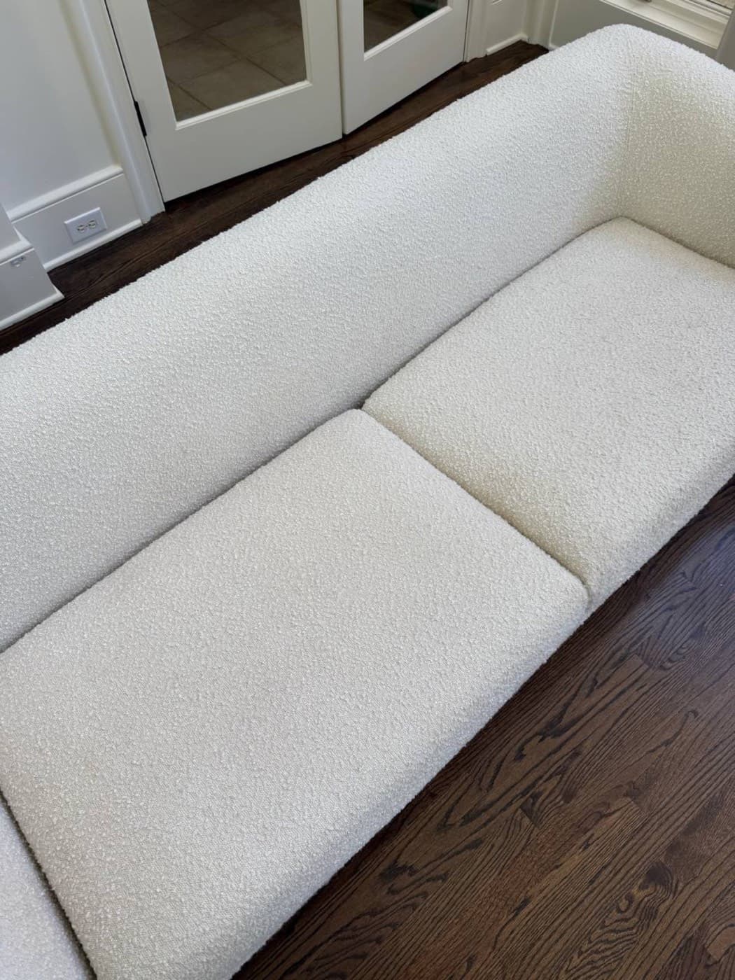 The same cream bench seat cushions after steam cleaning
