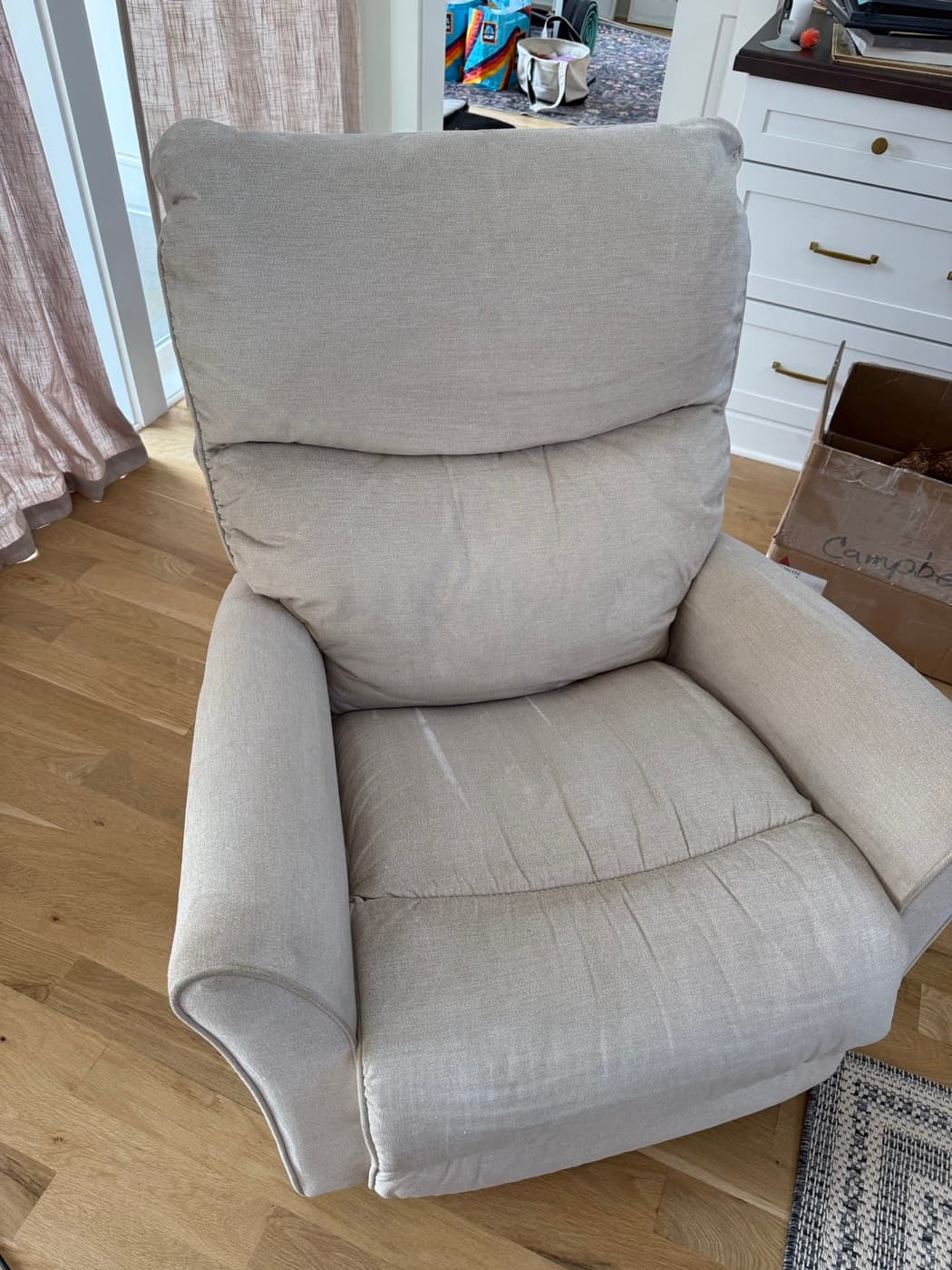 The same cream armchair after steam cleaning