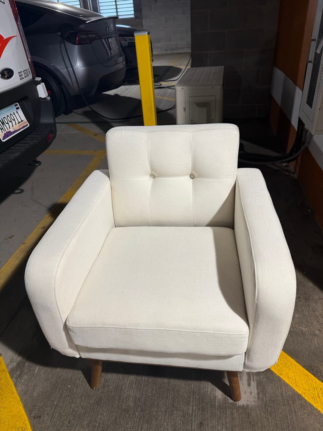 The same cream buttoned chair after steam cleaning