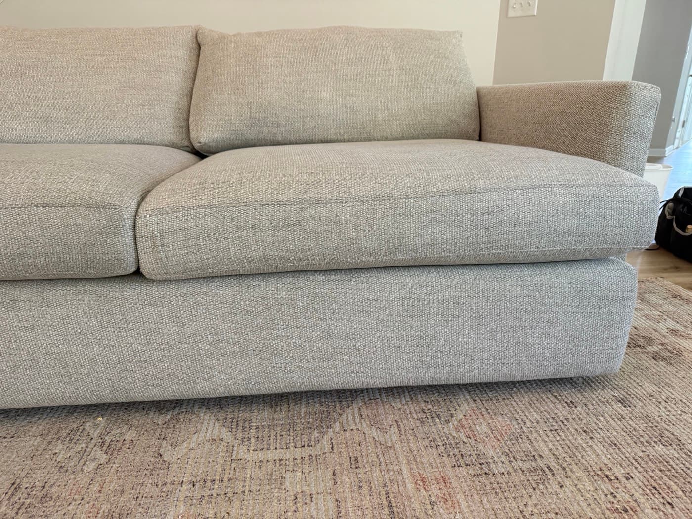 The same light grey sofa after steam cleaning