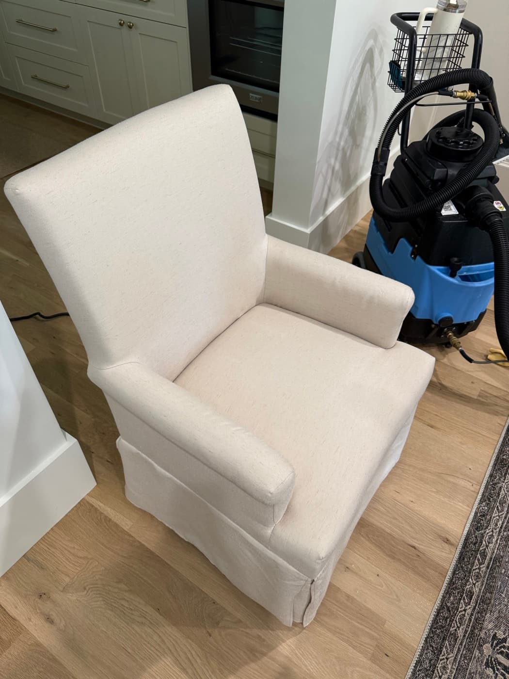 The same cream recliner chair after steam cleaning